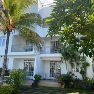 Apartment building with balconies and tropical garden at Appartement Hibiscus in Grand Baie