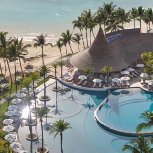 Pools, palm trees and the beach at LUX* Belle Mare Resort and Villas