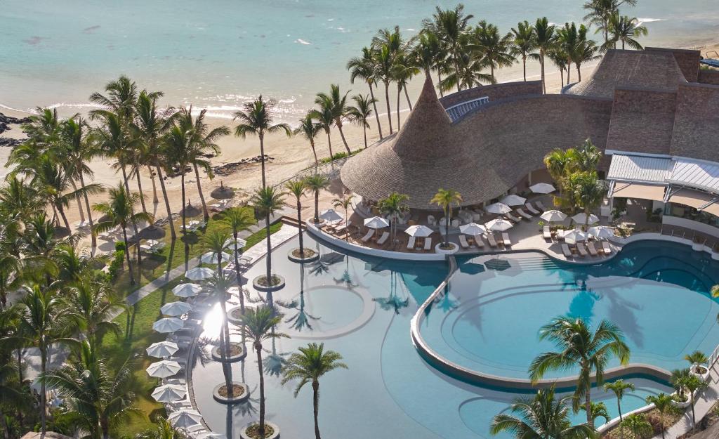 Pools, palm trees and the beach at LUX* Belle Mare Resort and Villas