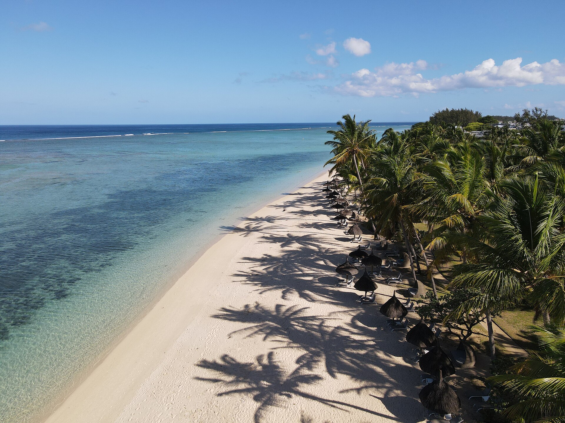 The long beach at Flic en Flac lined with casuarina trees