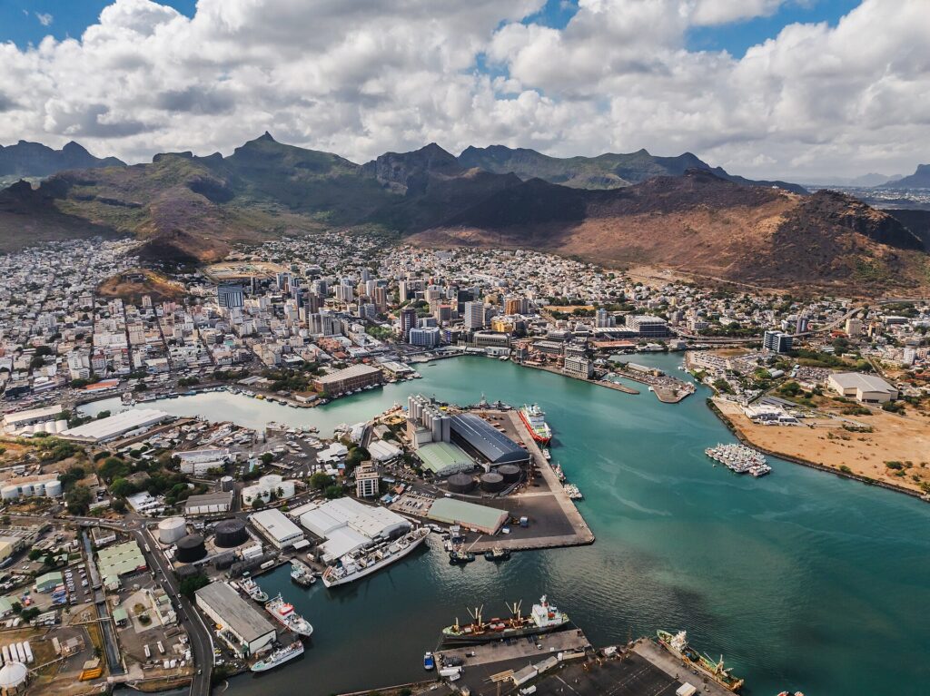 Aerial view of Port Louis harbour and city with mountains behind