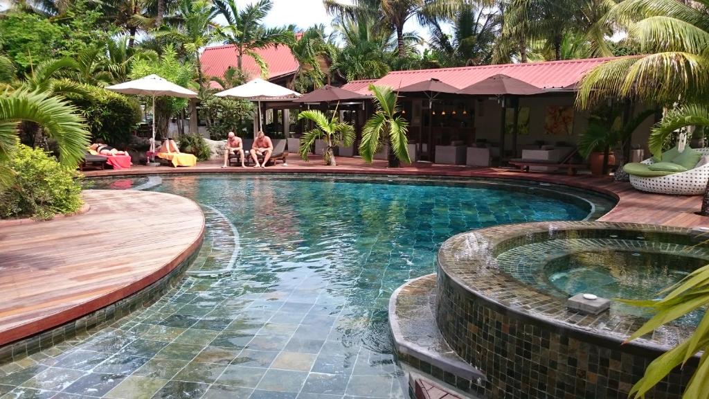 Swimming pool and garden buildings at Ocean Villas Hotel in Grand Baie