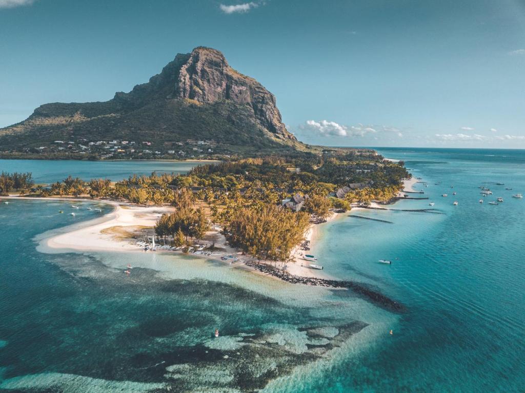 Aerial view of Paradis Beachcomber on the Le Morne peninsula with Le Morne Brabant behind